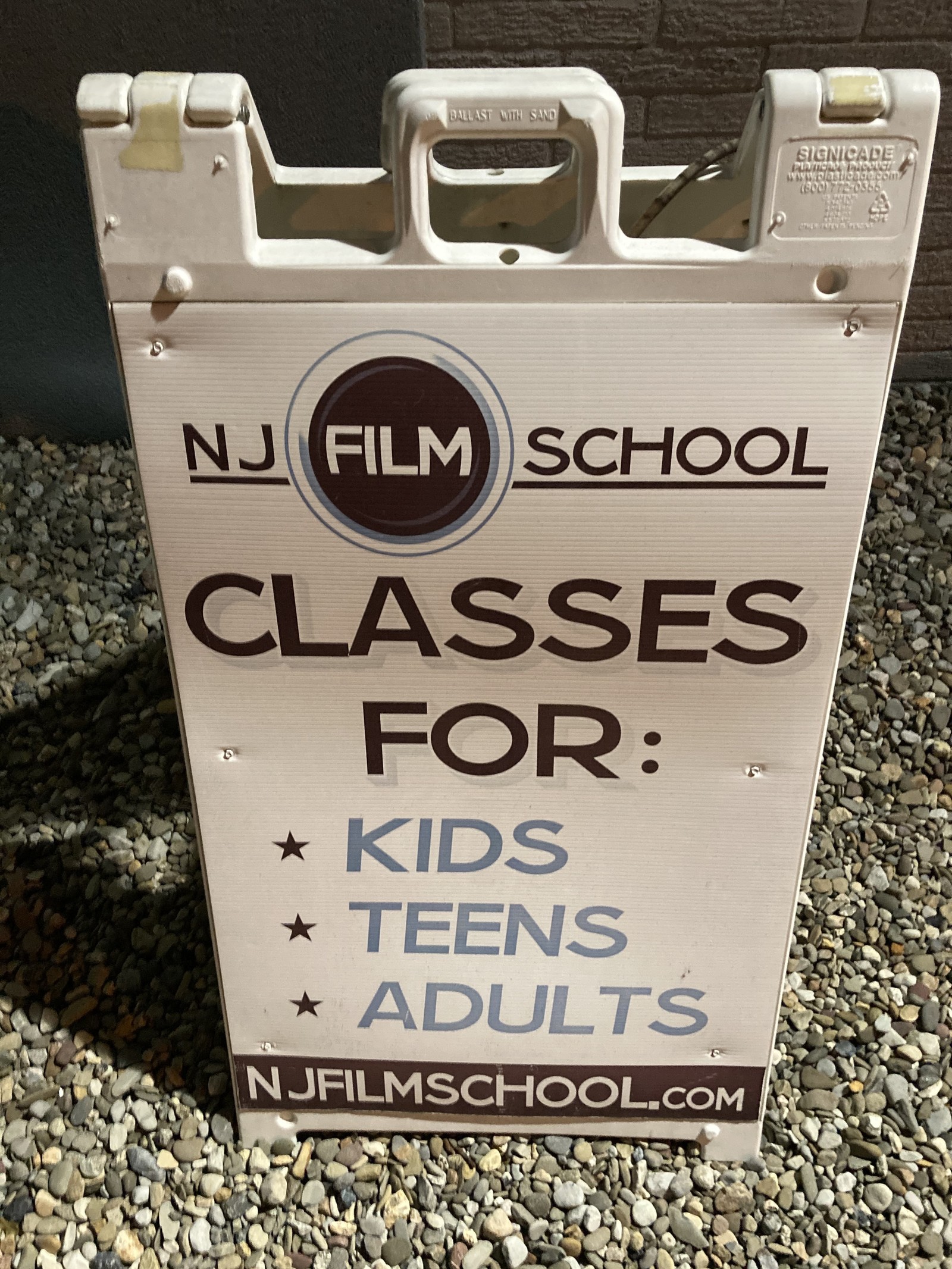 Sidewalk sign advertising NJ Film School classes