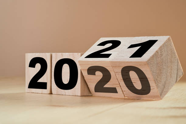Wooden blocks showing 2020, with the last block turning over to 21